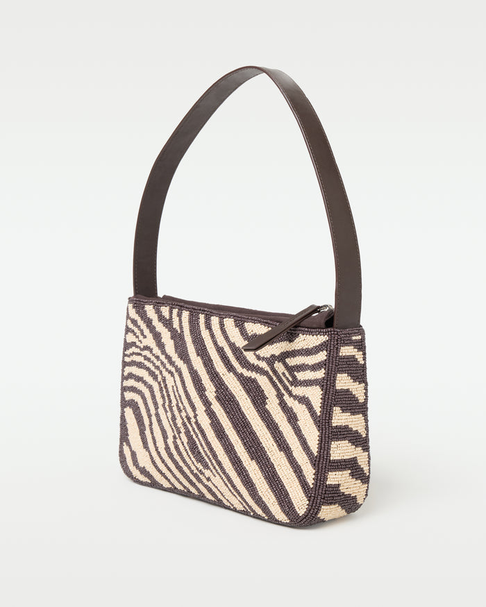 Side view of the animal print Alora Bag showing the structured silhouette.