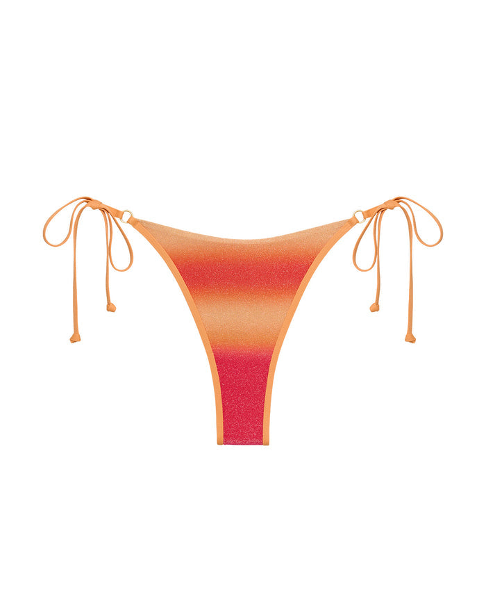 Off-model image of the LSPACE Ocaso Banning Bikini Bottom with ombre sunset print and side tie strings.