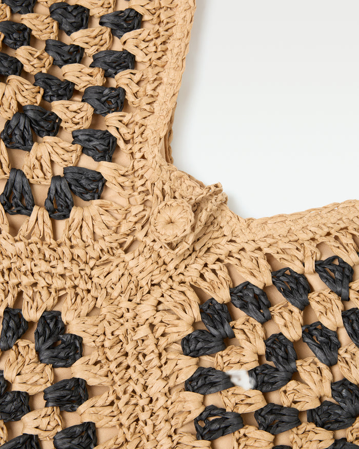 Close-up of the crochet texture detail on the natural black Coastline Beach Bag.