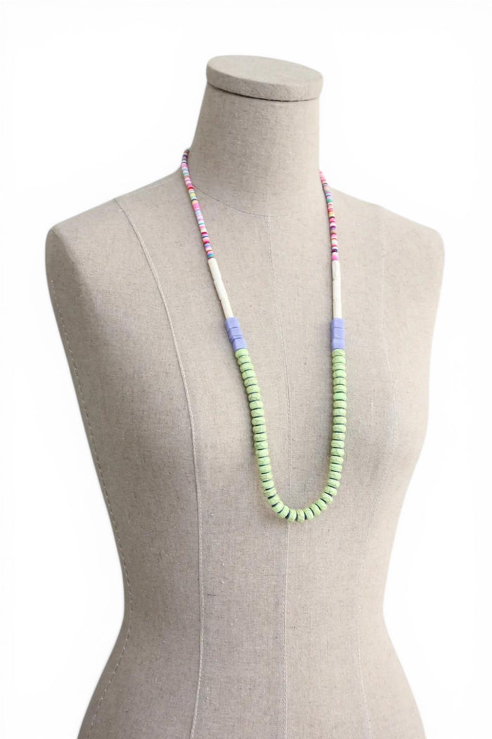 Bhoomki 31" necklace with 18k gold plated brass clasp, polymer clay, magnesite, vulcanite, and glass beads in green, white, and pastel confetti.
