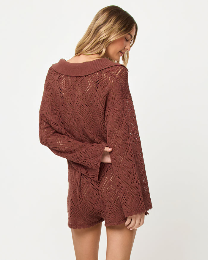 Back view of model wearing the LSPACE Golden Daze Romper in cafe.