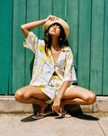 Wish You Were Here | Badge:New Arrival_#B2AC88_#ffffff'
LSPACE La Mer shirt in Wish You Were Here print, lifestyle view on model.