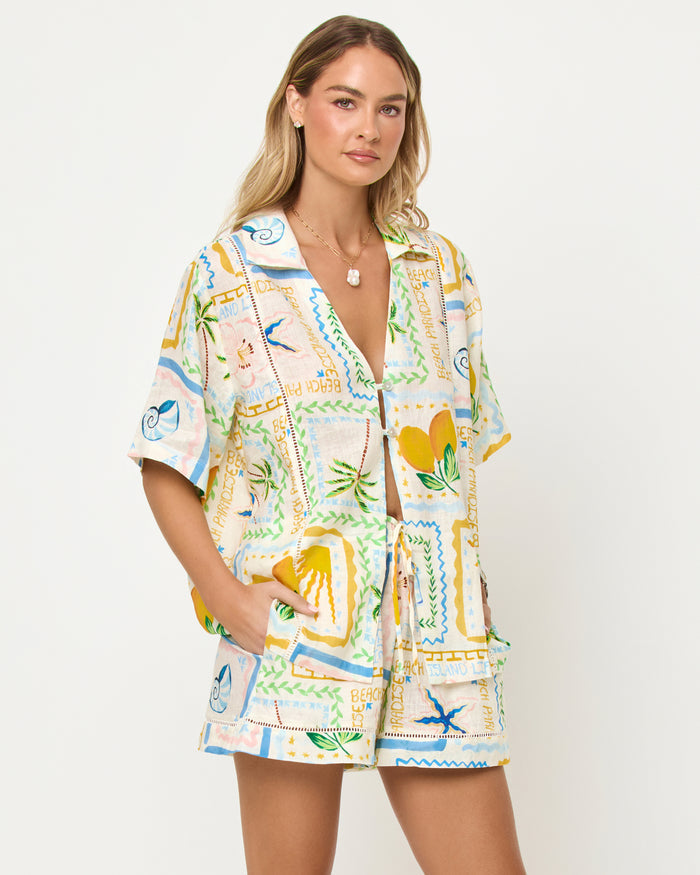 LSPACE La Mer shirt in Wish You Were Here print, three-quarter view on model.