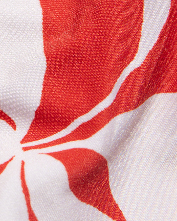 Close-up of red and white hibiscus bloom print fabric used in the LSPACE hibiscus bloom Mako Bikini Top.