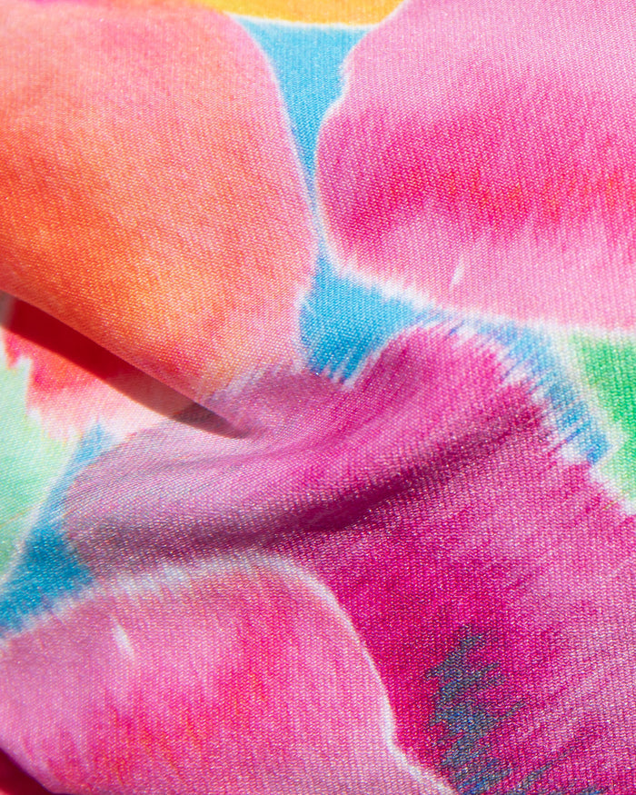 Close-up of multicolor watercolor floral print fabric used in the LSPACE flower play Piper One Piece Swimsuit.