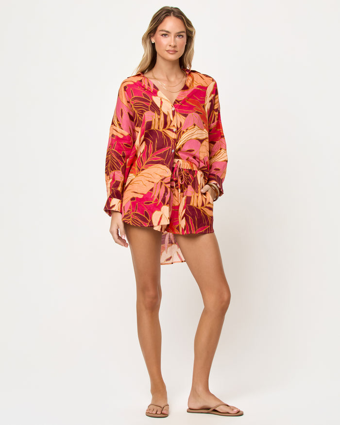 Front view of model wearing the LSPACE Rio Short in leaf it to me, a leaf-print drawstring short.