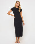 Angled front view of a model wearing the LSPACE Sloane Dress in black, a fitted maxi dress with a crew neckline and short cap sleeves.