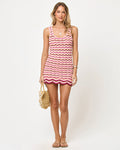 Front view of model wearing the LSPACE Sunchaser Dress in berry spritz, a crochet mini dress with a scoop neckline and scalloped hem in berry and pink tones.