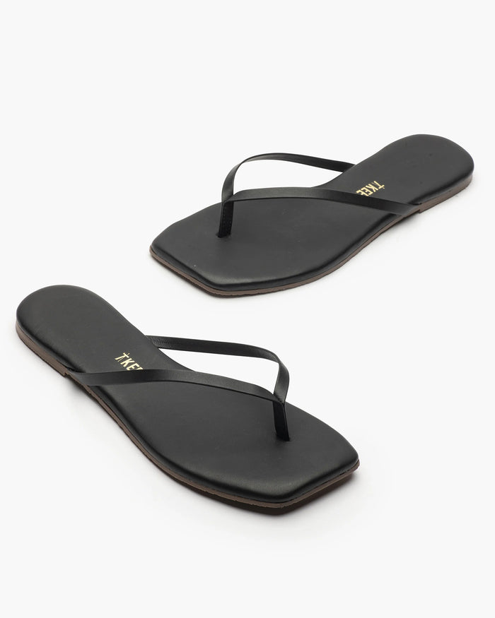 Off-model angled view of the TKEES Square Toe Lily Sandals in black.