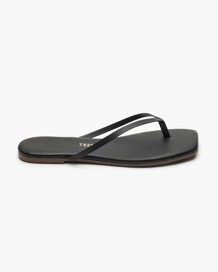 Close-up of the TKEES Square Toe Lily Sandals in black showing the strap and footbed detail.