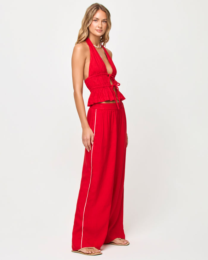 Side view of model wearing the LSPACE x The Salty Blonde August Top in flame.