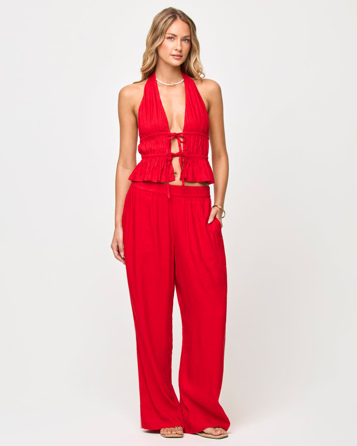 Front view of model wearing the LSPACE x The Salty Blonde August Top in flame, a cropped top in a warm orange-red tone.