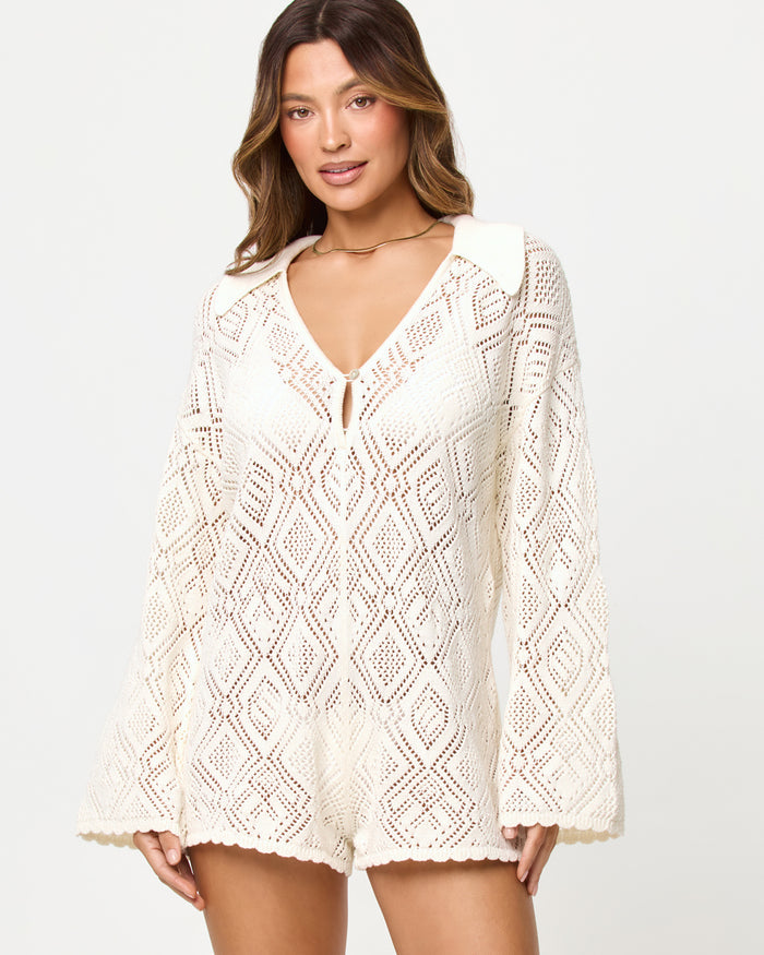 Close-up of the LSPACE x The Salty Blonde Golden Daze Romper in cream showing the neckline and bodice detail.