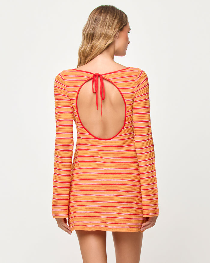 Back view of model wearing the LSPACE x The Salty Blonde Tita Dress in chili pepper stripe.