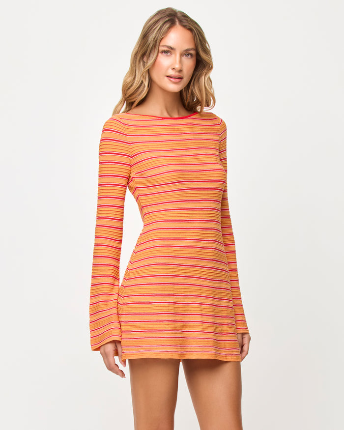 Side view of model wearing the LSPACE x The Salty Blonde Tita Dress in chili pepper stripe.